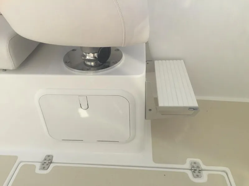 Slide: The Image of 2024 NorthCoast 235 HT boat interior with seat and storage compartment. - 10