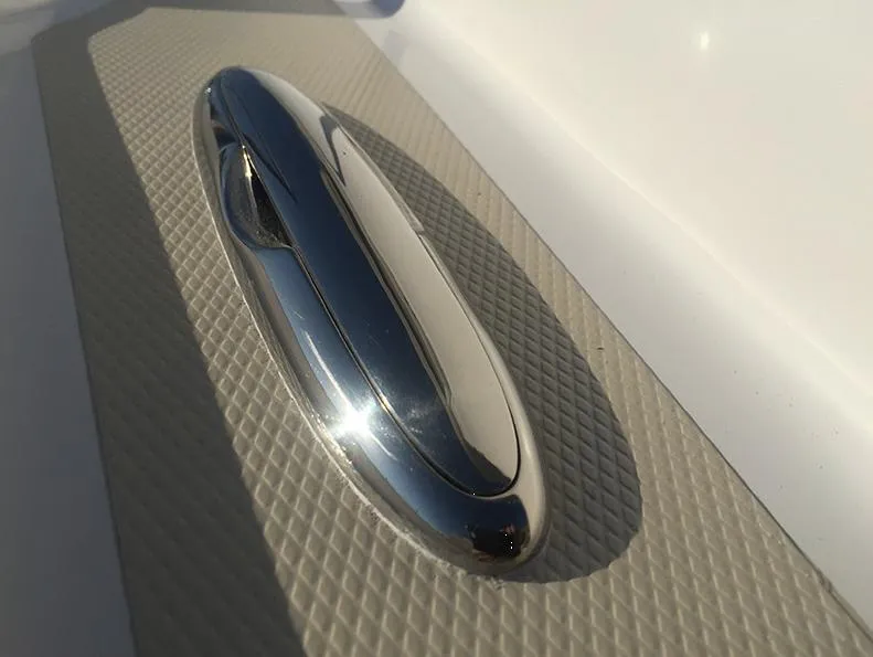 Slide: The Image of 2024 NorthCoast 235 HT boat cleat on textured deck surface. - 14