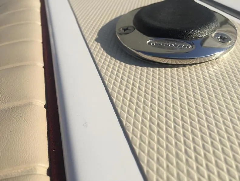 Slide: The Image of Close-up of 2024 NorthCoast 235 HT boat deck with textured surface and metal fitting. - 15