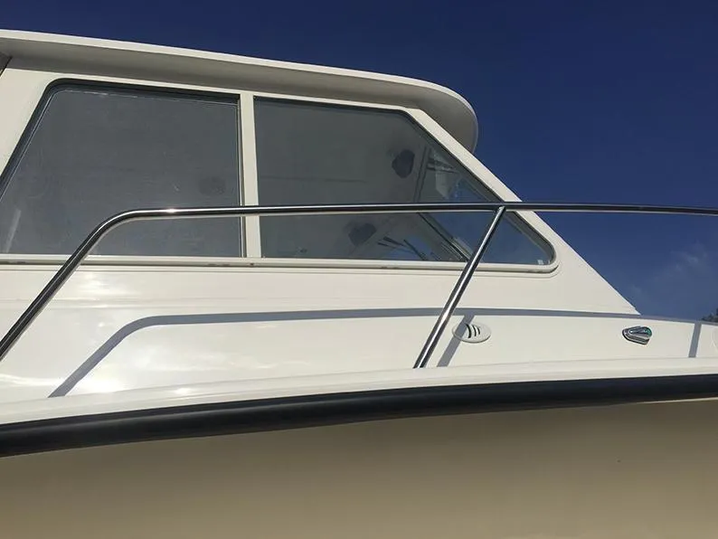 Slide: The Image of 2024 NorthCoast 235 HT boat cabin with sleek design and clear windows. - 4