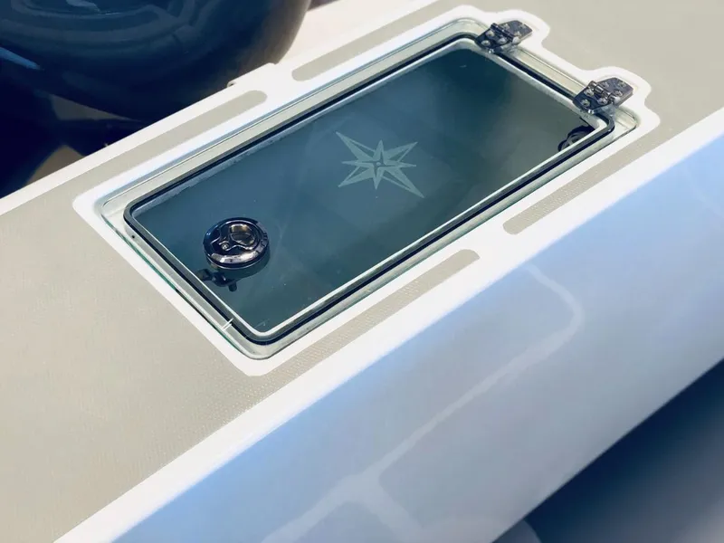 Slide: The Image of 2024 NorthCoast 235 HT boat hatch with star design and secure latch. - 5