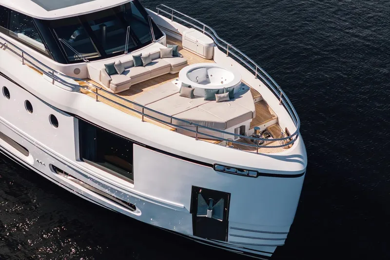 Slide: The Image of 2026 Azimut Magellano 30M yacht with luxurious deck and seating area on the water. - 1