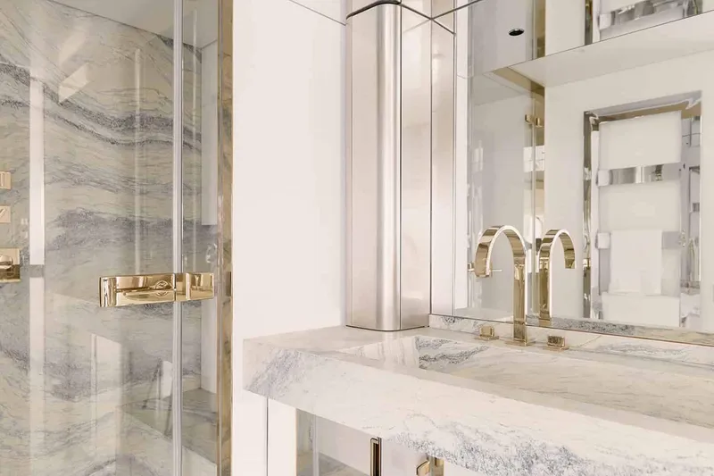 Slide: The Image of Manufacturer Provided Image: Luxurious bathroom interior of 2025 Azimut Magellano 30M yacht with marble and gold accents. - 14