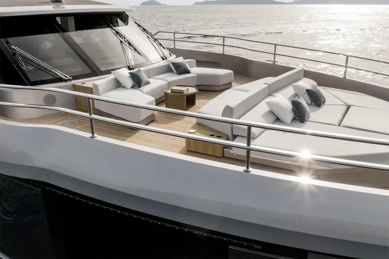 Slide: The Image of Manufacturer Provided Image: Luxurious 2025 Azimut Magellano 30M yacht deck with elegant seating and ocean view. - 9