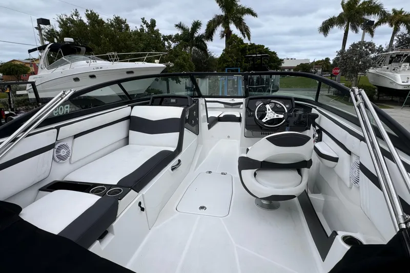 Slide: The Image of 2020 Monterey M-225 boat interior with sleek seating and modern dashboard. - 11