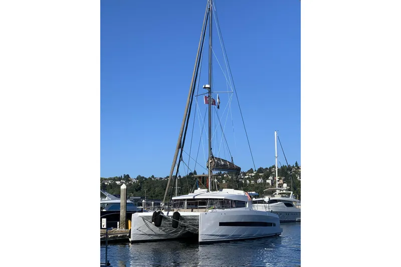 The Image of Sailing catamaran Bali 4.1, 2019 model, docked in a marina under clear blue skies. - 0