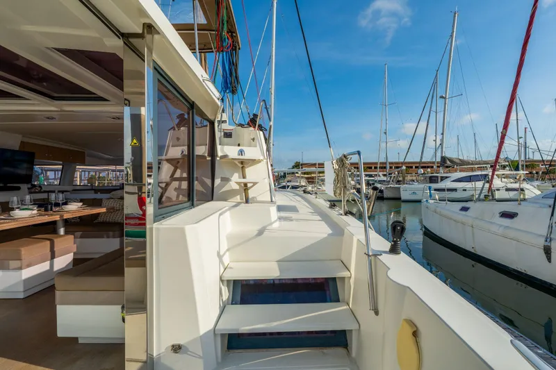 Slide: The Image of Interior of 2019 Bali 4.1 yacht with elegant dining setup and marina view. - 13