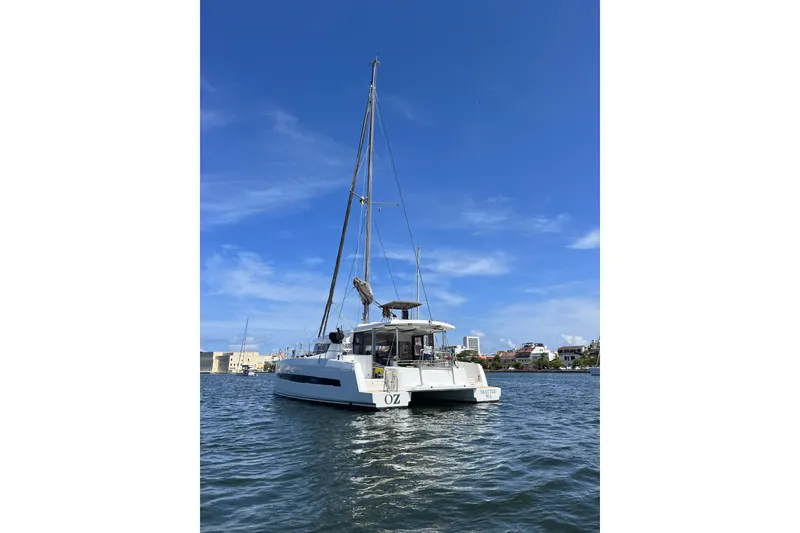 Slide: The Image of 2019 Bali 4.1 catamaran docked at marina under clear blue sky. - 2