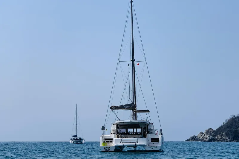 Slide: The Image of 2019 Bali 4.1 catamaran sailing on calm waters under a clear blue sky. - 3