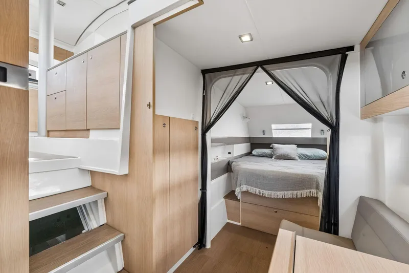 Slide: The Image of Modern cabin interior of 2019 Bali 4.1 yacht with cozy bed and porthole windows. - 33