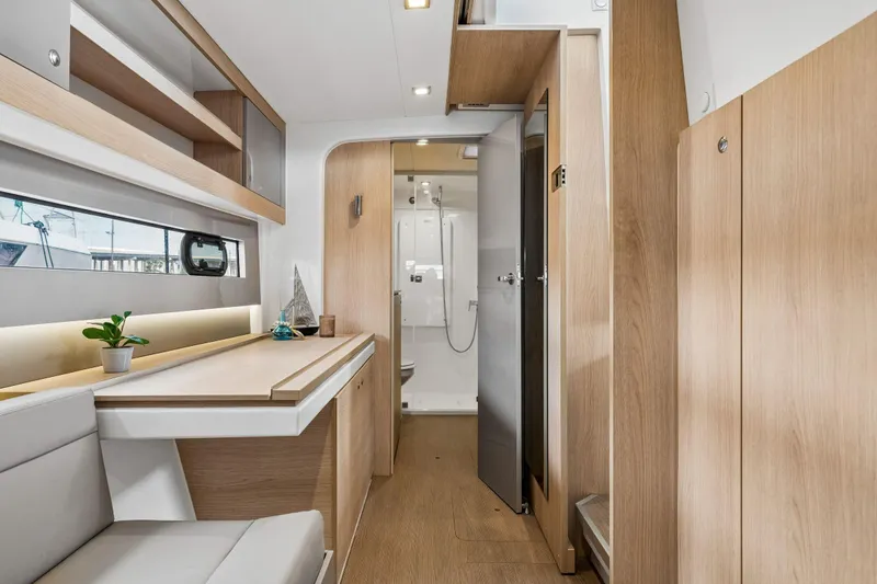 Slide: The Image of Modern bathroom in 2019 Bali 4.1 yacht with sink, mirror, and wooden cabinetry. - 34