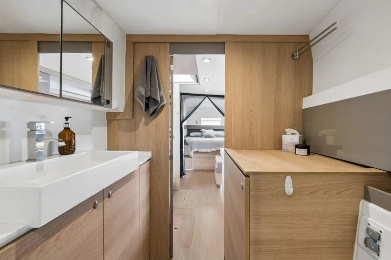 Slide: The Image of Modern bathroom in a 2019 Bali 4.1 yacht with sink and washing machine. - 37