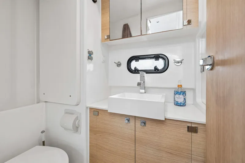 Slide: The Image of Control panel of a 2019 Bali 4.1 catamaran with navigation and communication equipment. - 41