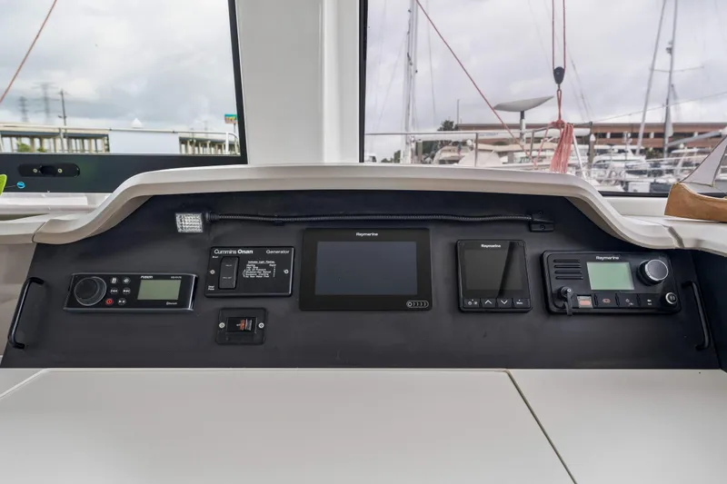 Slide: The Image of Open storage compartment on a 2019 Bali 4.1 boat with various equipment inside. - 47