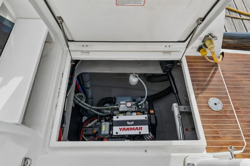 Slide: The Image of Luxurious Bali 4.1 catamaran docked in marina, showcasing spacious deck and seating, 2019 model. - 51