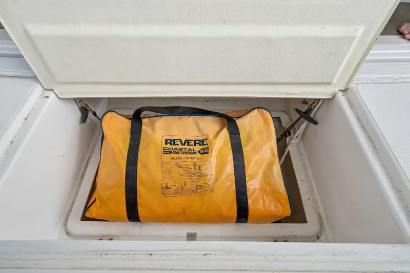 Slide: The Image of Bali 4.1 catamaran docked at marina, surrounded by other boats, under cloudy sky. - 53