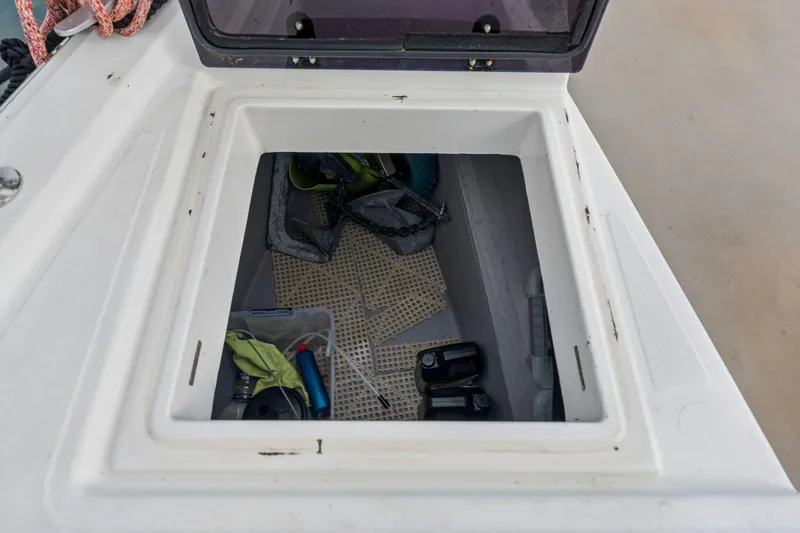 Slide: The Image of 2019 Bali 4.1 catamaran with spacious deck and seating area in a marina. - 54