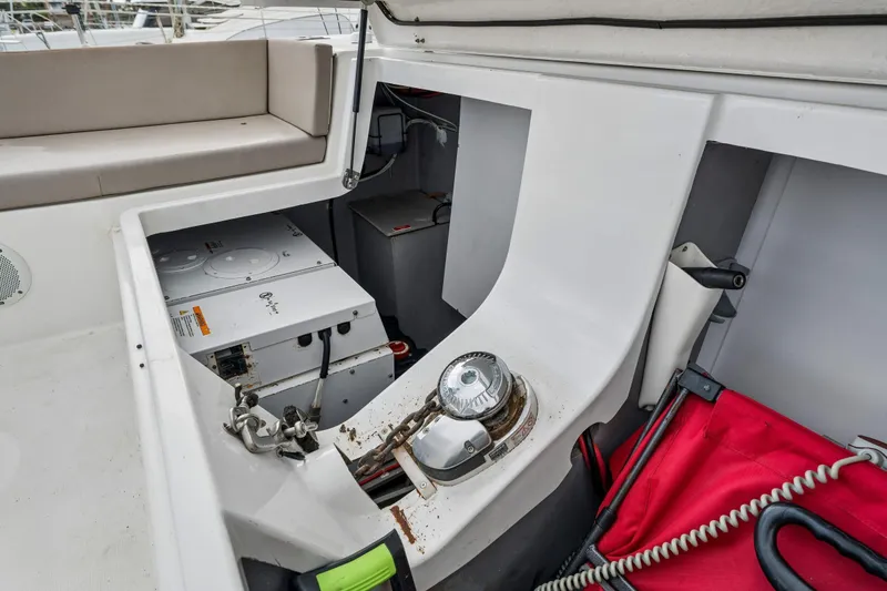 Slide: The Image of Modern Bali 4.1 catamaran from 2019 docked in a marina, featuring spacious seating area. - 56