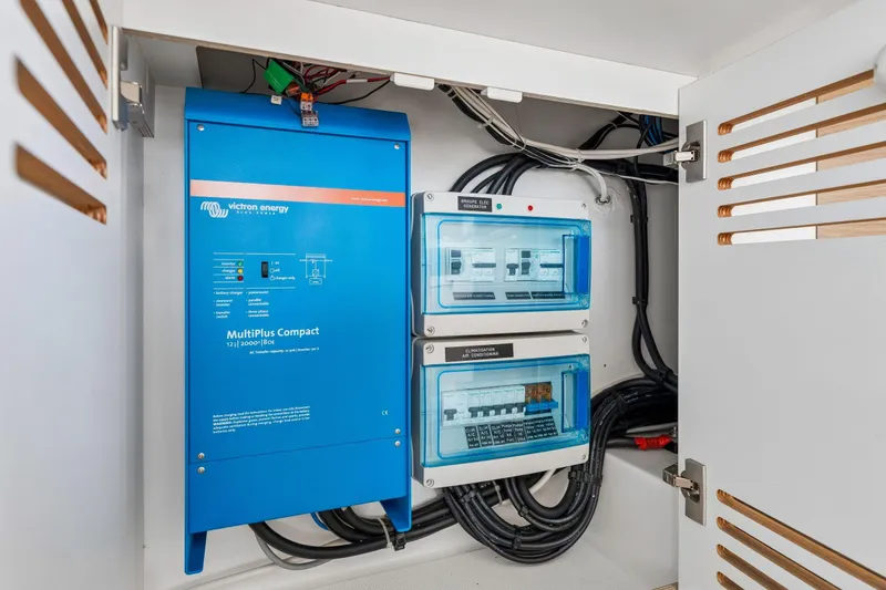 Slide: The Image of 2019 Bali 4.1 catamaran with outdoor seating and tables in a marina setting. - 57