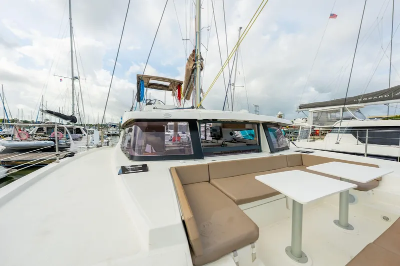 Slide: The Image of Sailing yacht Bali 4.1, 2019 model, docked in a marina under cloudy skies. - 59
