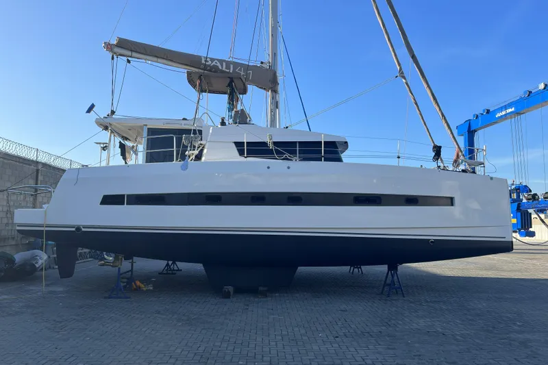 Slide: The Image of 2019 Bali 4.1 catamaran on dry dock, showcasing sleek design and modern features. - 6