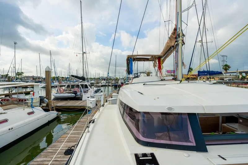 Slide: The Image of 2019 Bali 4.1 catamaran docked at marina under blue sky. - 60