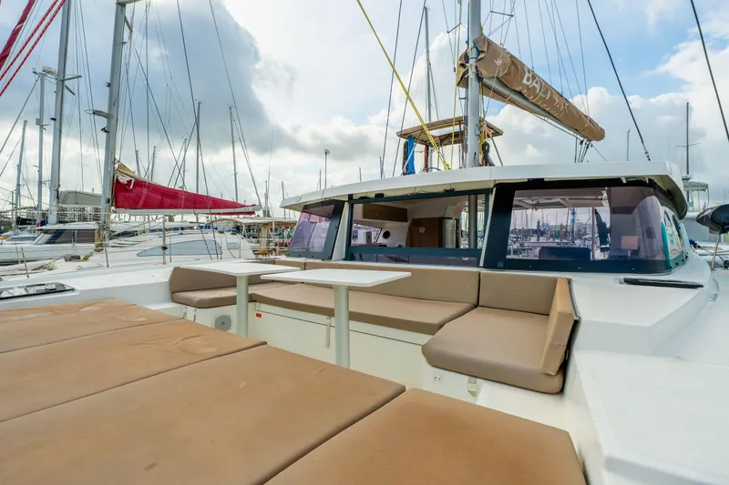 Slide: The Image of Sailboat Bali 4.1, 2019 model, docked at marina with cloudy sky. - 62