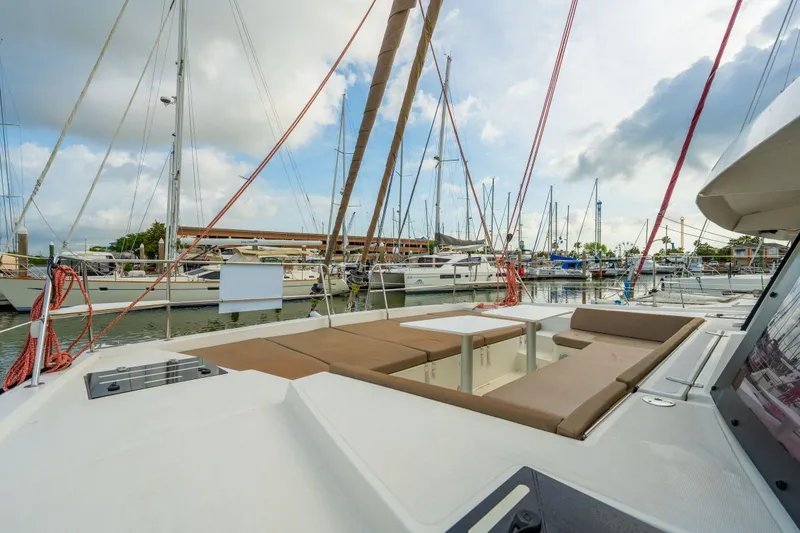 Slide: The Image of Steering area of a 2019 Bali 4.1 yacht with colorful ropes in a marina. - 63