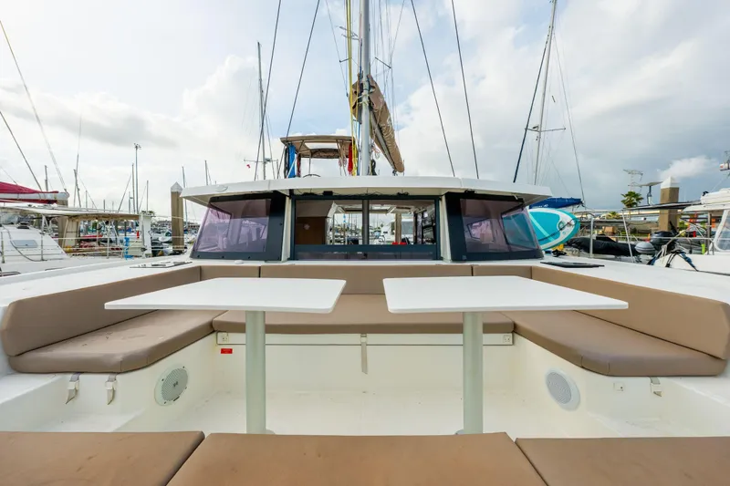 Slide: The Image of Solar panels on a 2019 Bali 4.1 catamaran docked at a marina. - 64