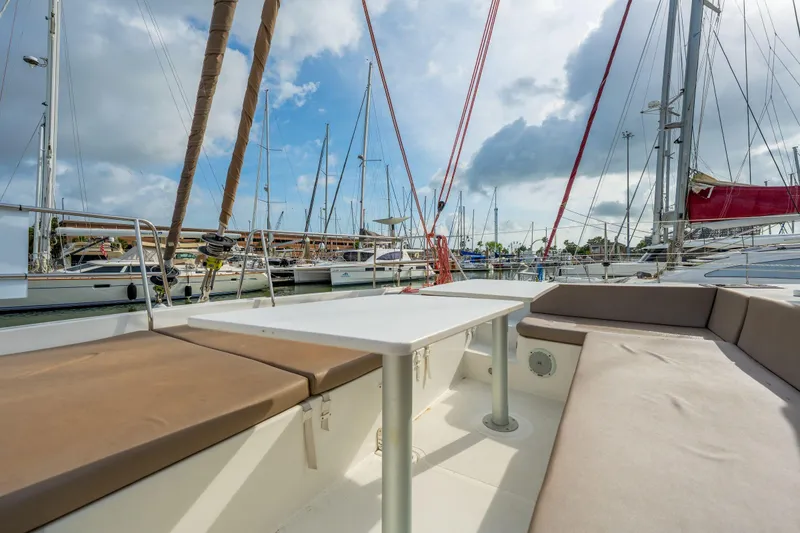 Slide: The Image of Sailing yacht Bali 4.1 (2019) docked in marina, featuring solar panels and clear blue skies. - 65