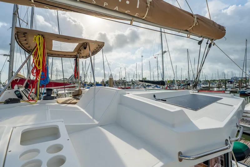 Slide: The Image of Steering wheel of a 2019 Bali 4.1 yacht with colorful ropes in a marina. - 66