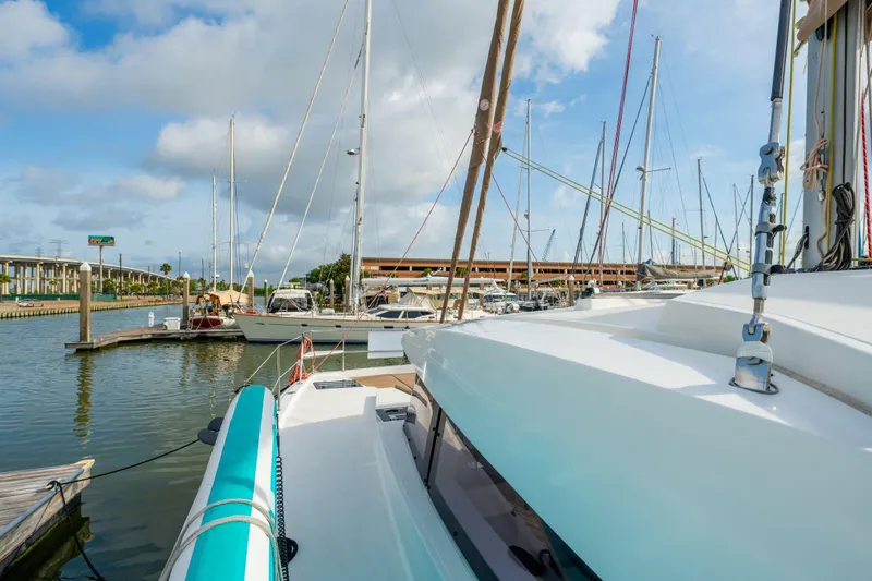 Slide: The Image of Sailing yacht deck with ropes and control panel, Bali 4.1 model, 2019, marina background. - 67