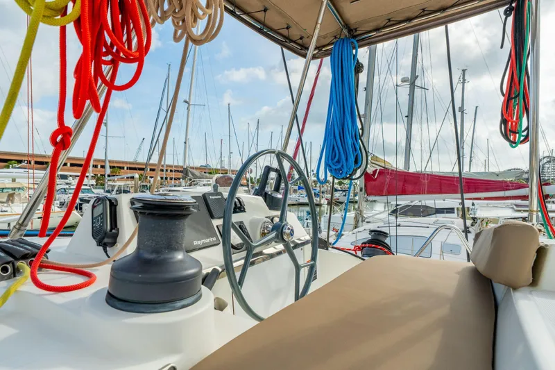 Slide: The Image of Sailboats docked at marina with Bali 4.1 yacht, 2019 model, featuring satellite dish. - 70