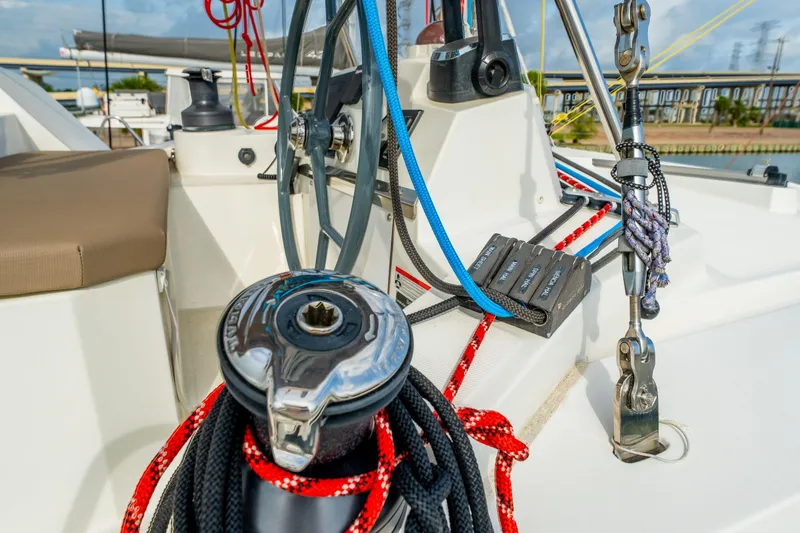 Slide: The Image of Sailboat Bali 4.1 (2019) cruising on calm green waters under cloudy skies. - 76