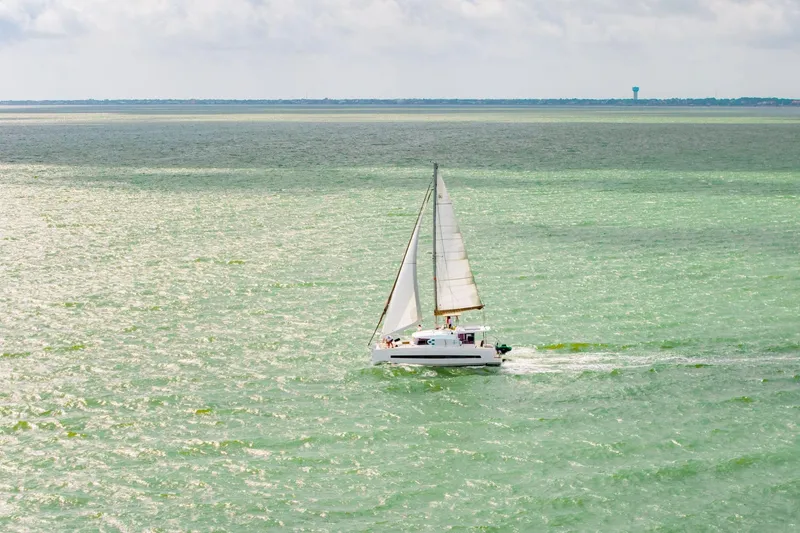 Slide: The Image of Sailing catamaran Bali 4.1, 2019 model, cruising on open sea under clear skies. - 82