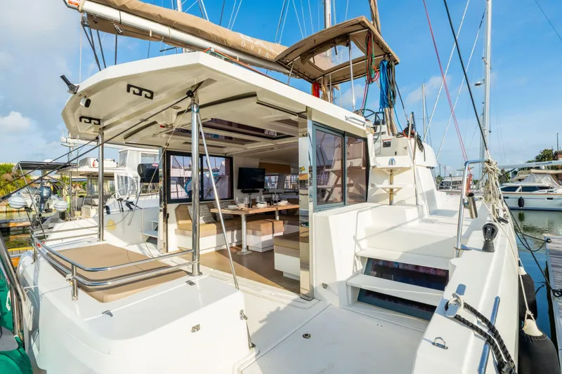 Slide: The Image of Modern 2019 Bali 4.1 catamaran with spacious deck and elegant interior dining area. - 9