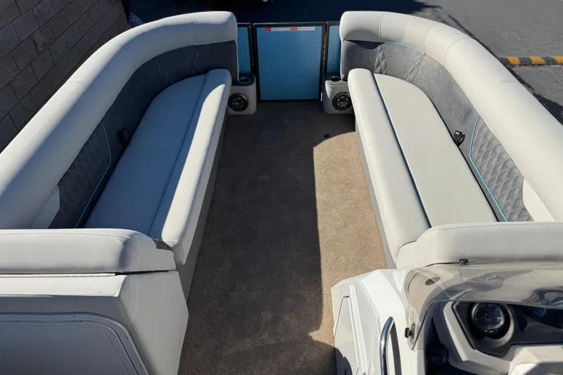 Slide: The Image of Interior of 2021 Crest Classic Platinum 240 SLC pontoon boat with plush seating. - 10