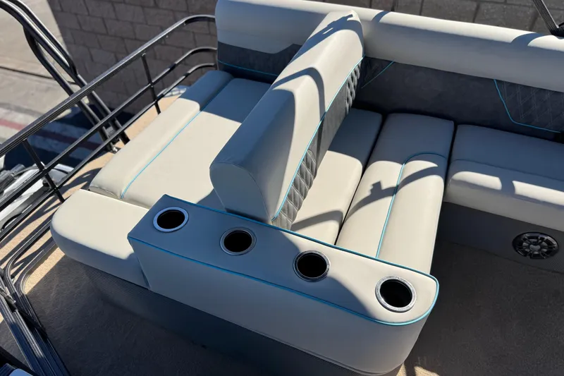 Slide: The Image of Luxurious seating on 2021 Crest Classic Platinum 240 SLC pontoon boat with cup holders. - 17