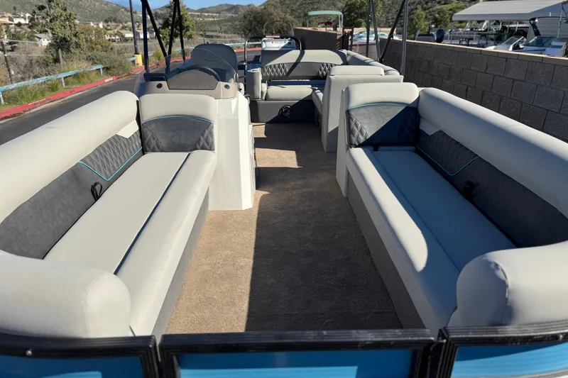 Slide: The Image of 2021 Crest Classic Platinum 240 SLC pontoon boat interior with spacious seating. - 9