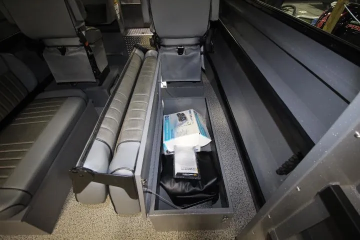 Slide: The Image of Interior storage compartment of 2026 Alumaweld Horizon 24 boat with seating and equipment. - 11