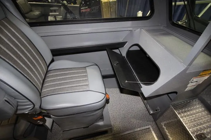 Slide: The Image of 2026 Alumaweld Horizon 24 interior with gray seating and storage compartment. - 13