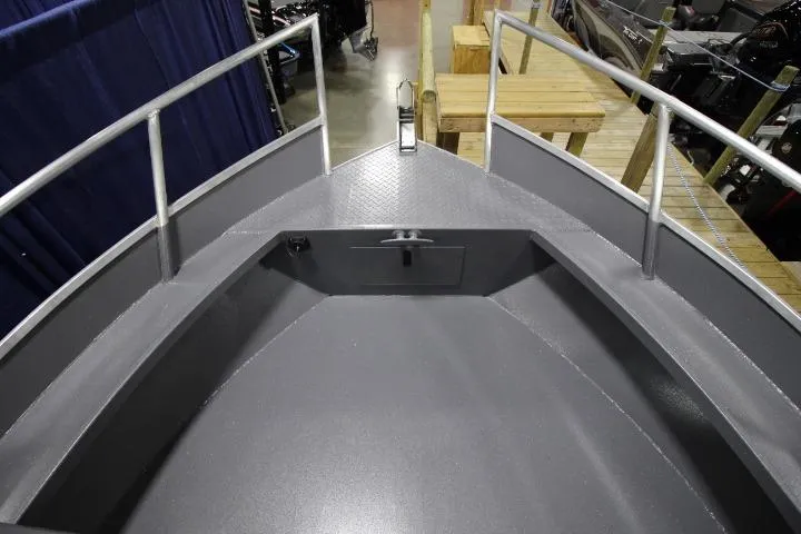 Slide: The Image of 2026 Alumaweld Horizon 24 boat deck with railing and storage compartment. - 2