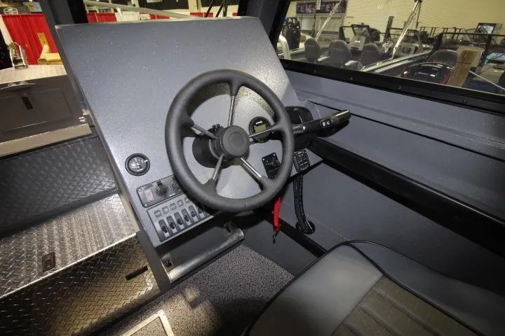 Slide: The Image of Steering console of 2026 Alumaweld Horizon 24 boat with modern controls and dashboard. - 3