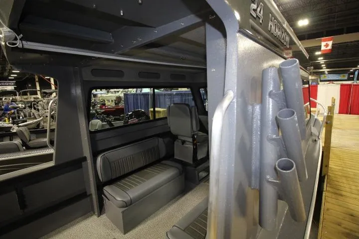 Slide: The Image of Interior view of 2026 Alumaweld Horizon 24 boat, showcasing seating and rod holders. - 5