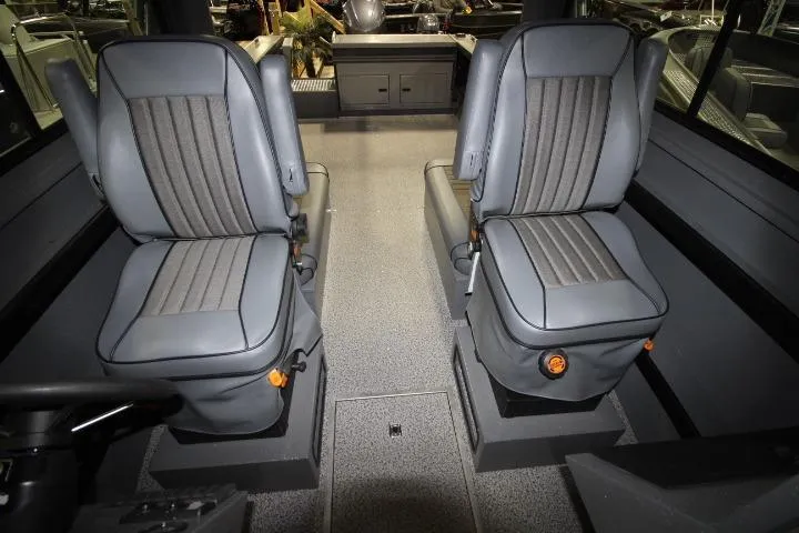 Slide: The Image of Interior of 2026 Alumaweld Horizon 24 boat featuring two gray captain's chairs. - 7