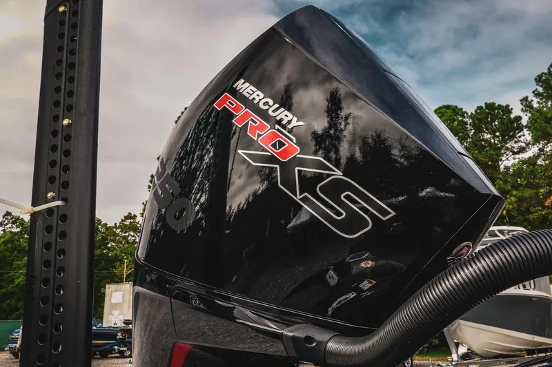 Slide: The Image of 2026 Bass Cat Cougar FTD with Mercury Pro XS engine, outdoor setting. - 14