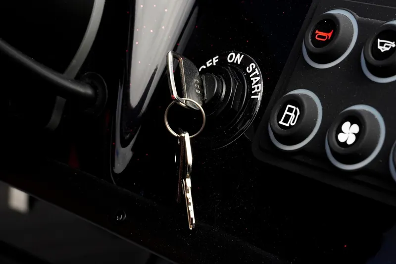 Slide: The Image of 2026 Bass Cat Cougar FTD ignition with keys and control panel. - 15