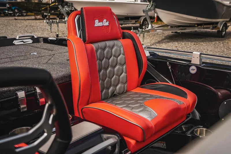 Slide: The Image of 2026 Bass Cat Cougar FTD boat seat, red and gray design, luxurious and sporty interior. - 17