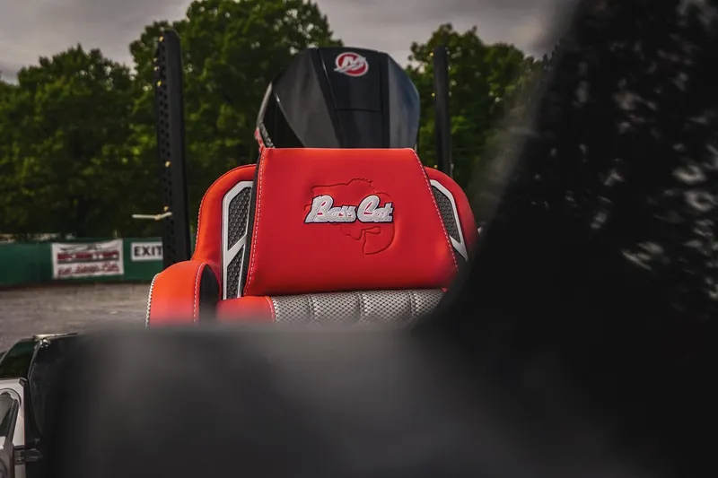 Slide: The Image of 2026 Bass Cat Cougar FTD Special Package seat with logo, outdoors setting. - 18
