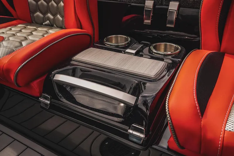 Slide: The Image of 2026 Bass Cat Cougar FTD interior with red seats and dual cup holders. - 24